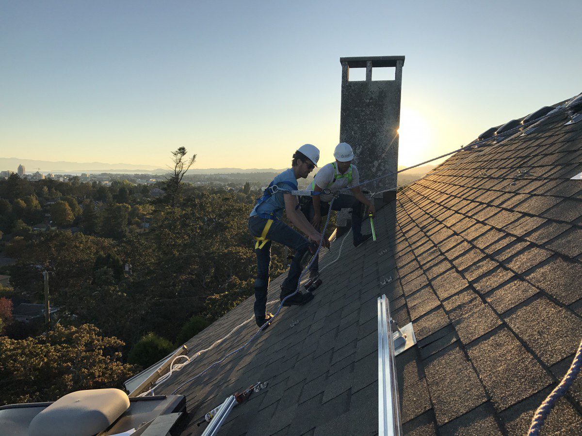 Shift crew members working on a Vancouver Island roof
