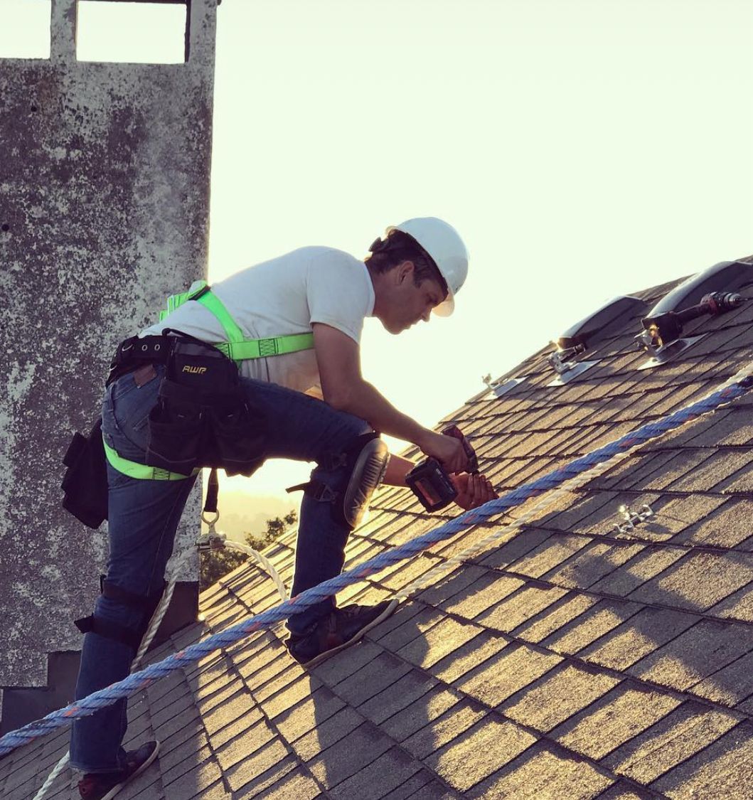 Shift installer on asphalt shingle roof